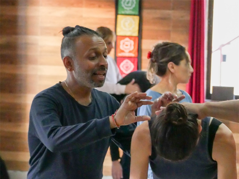 founder of yoga sadhana and teacher Praveen Nair teaching the student in Yoga teacher training school in Rishikesh